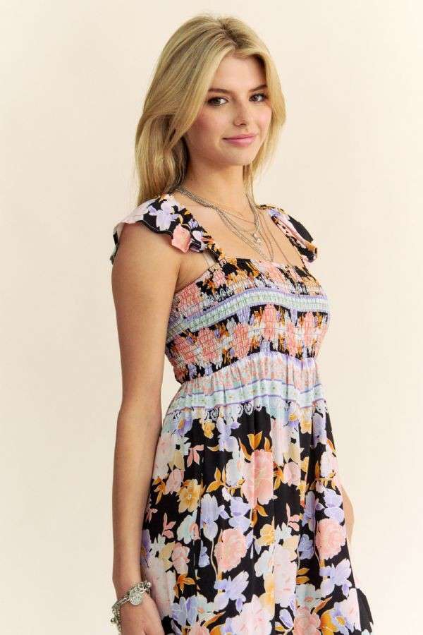 FLORAL BORDER SMOCKED BODICE RUFFLED JUMPSUIT