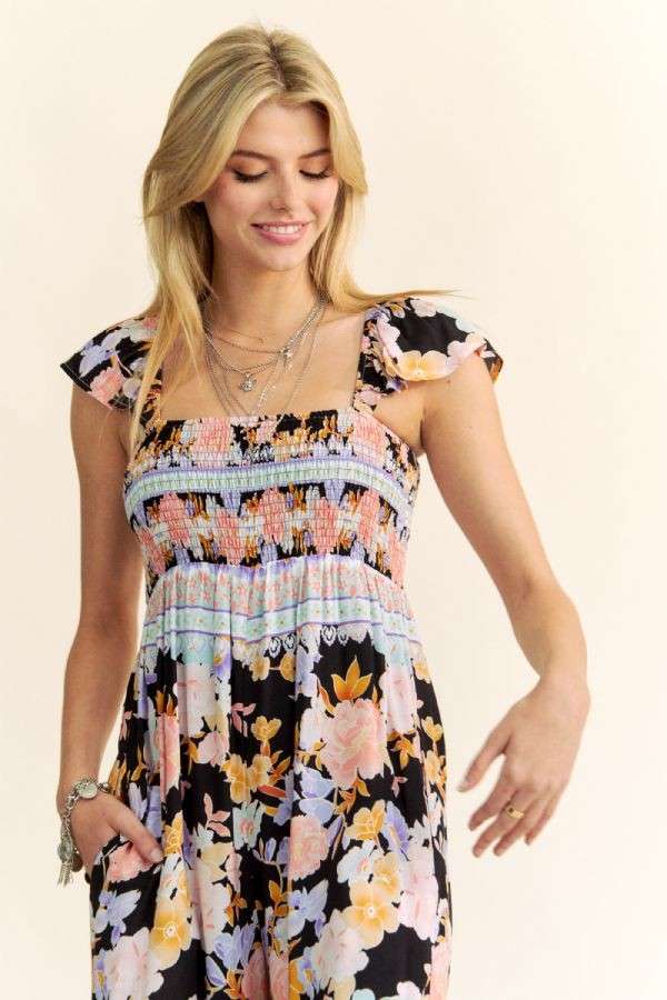 FLORAL BORDER SMOCKED BODICE RUFFLED JUMPSUIT